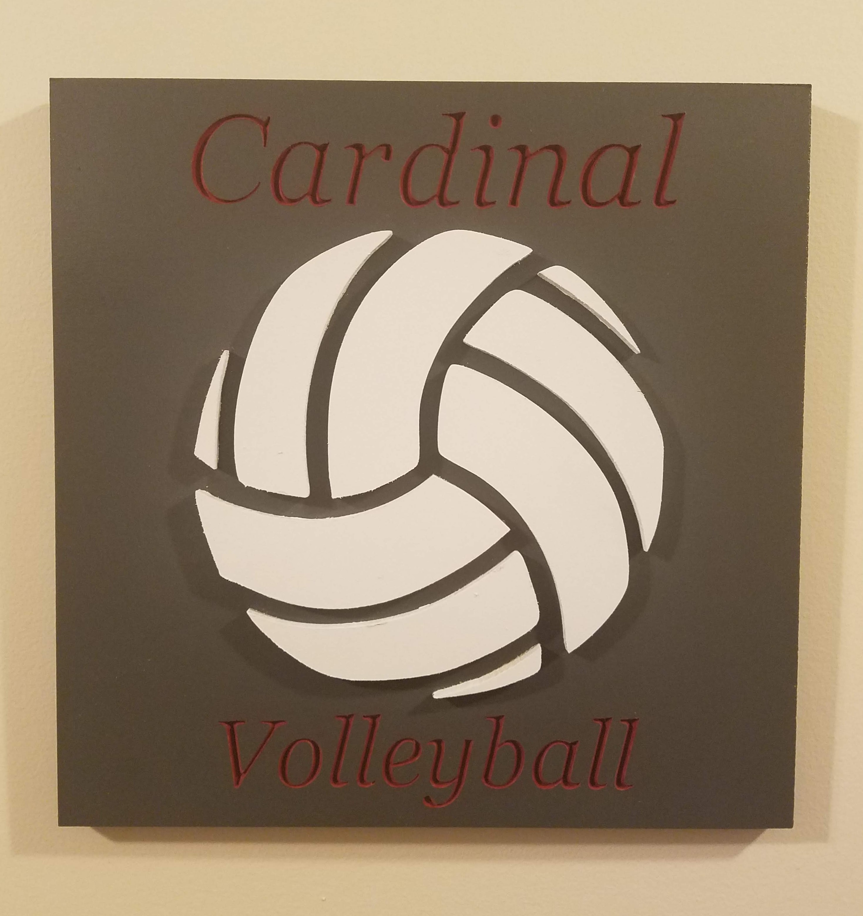 Picture of wooden cardinal volleyball sign with raise volleyball.