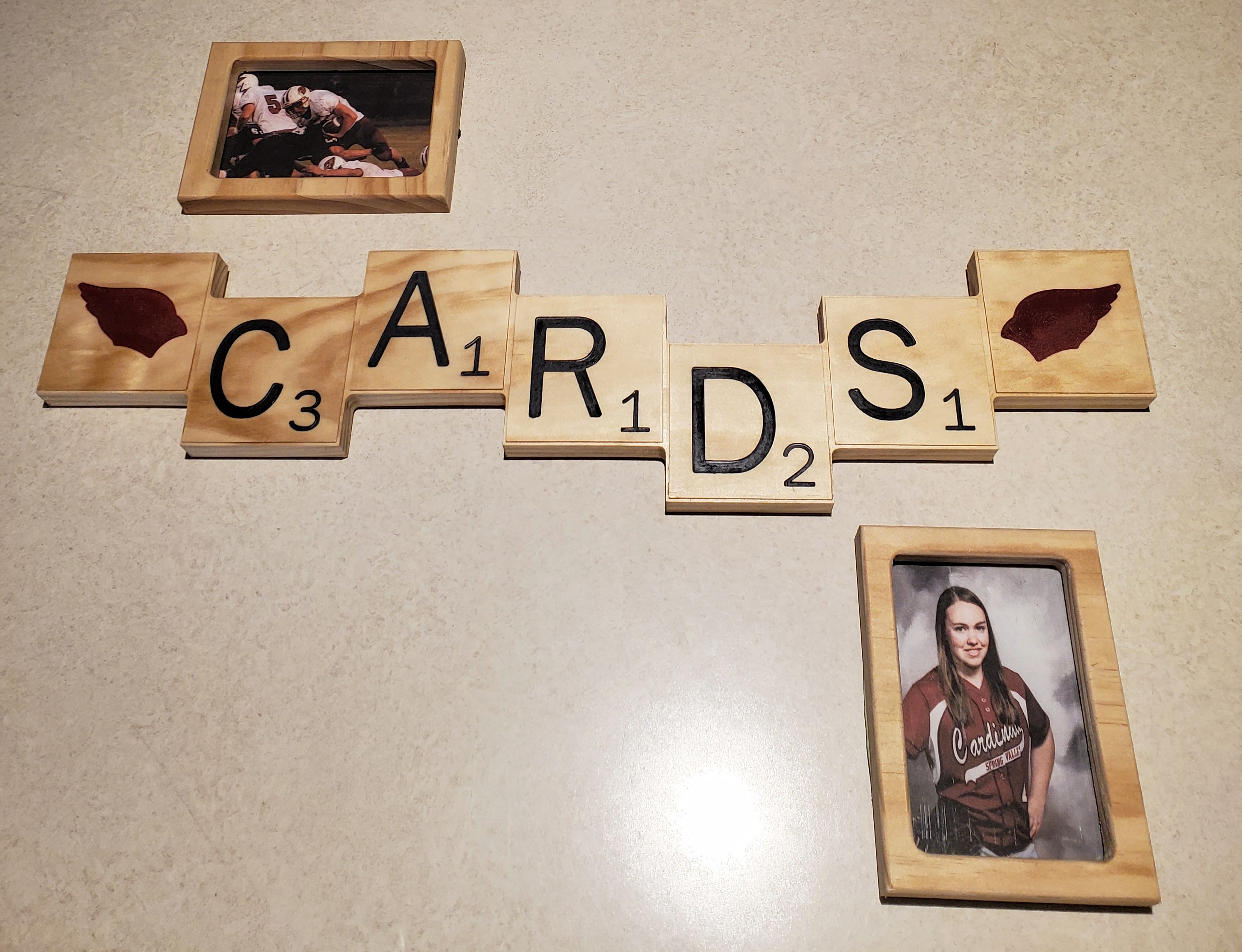 Picture of wooden scrabble tile pieces that spell out cards.