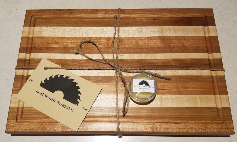 Picture of finished product of handmade cutting board. All cutting boards come with a free sample of board butter.