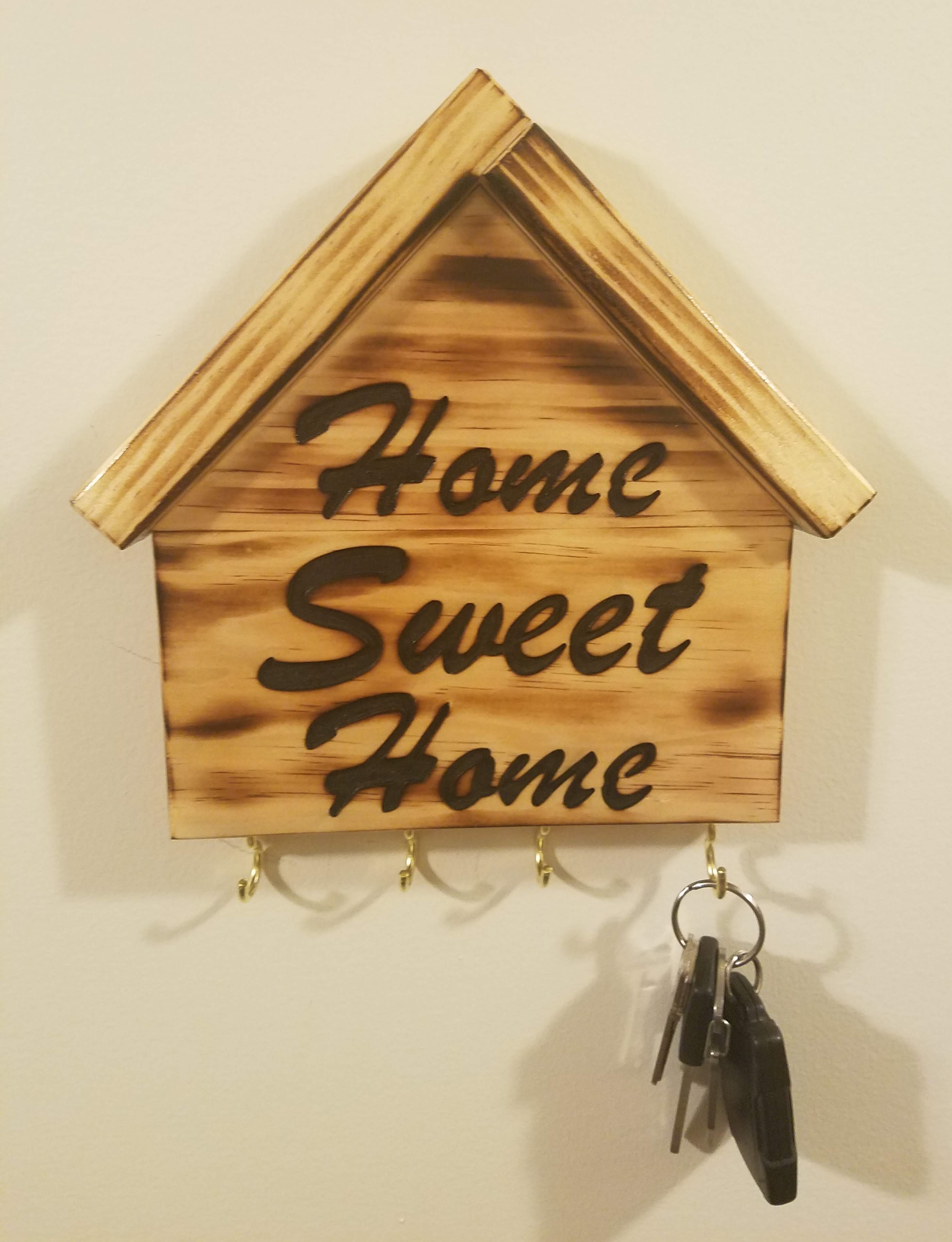 Picture of wooden 'Home Sweet Home' house key ring holder.