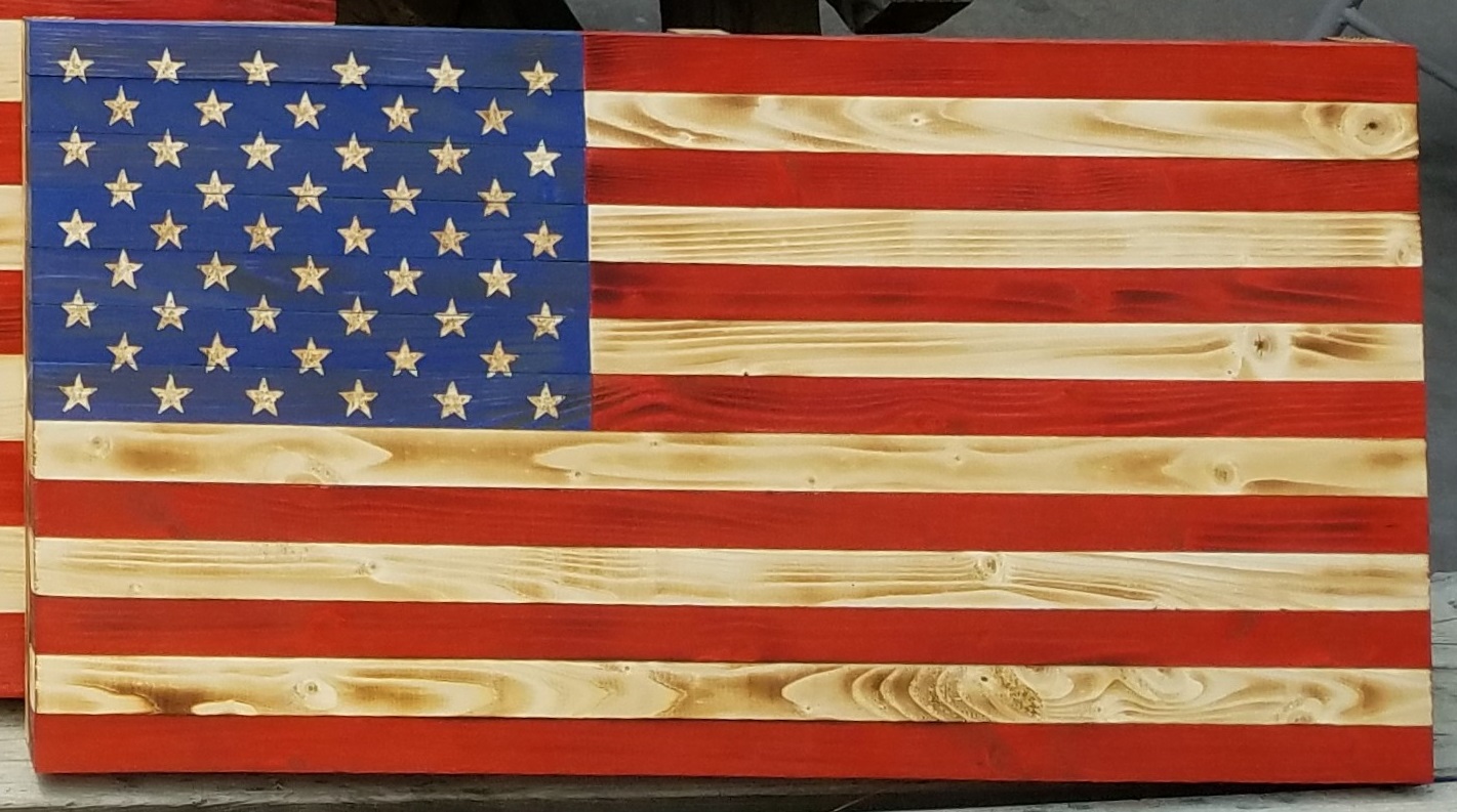 Picture of rustic small American flag. This flag measures 24.5 inches by 13 inches.