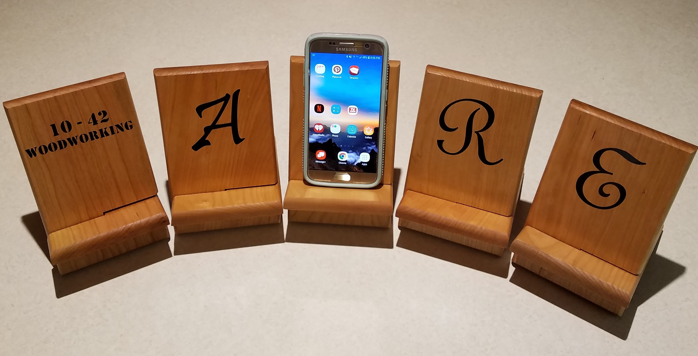 Picture of multiple phone holders. The front can be customized with a personalized sticker.