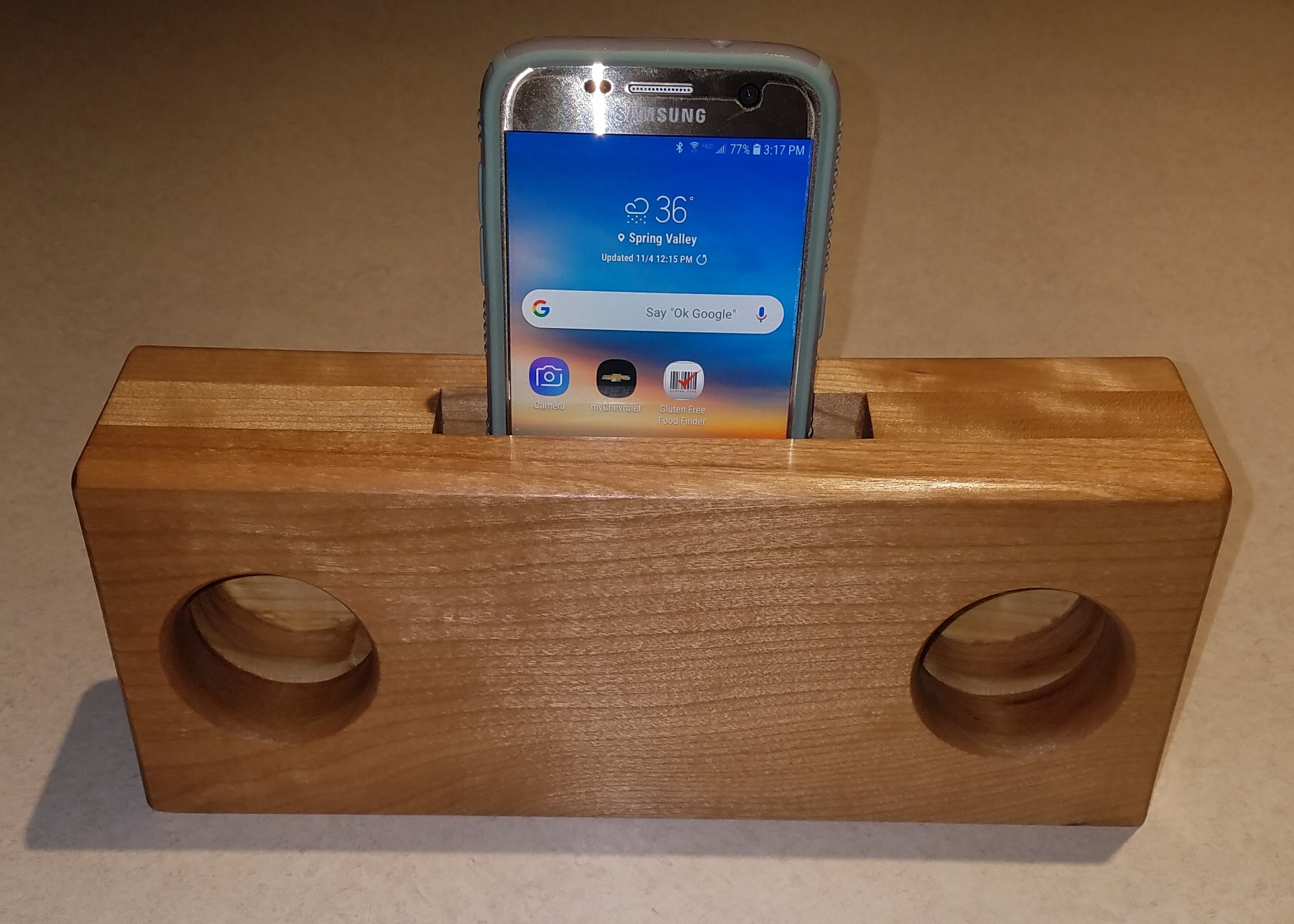 Close up picture of the wooden phone speaker.